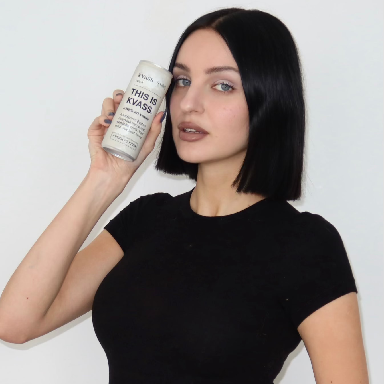 Woman holding a can of 'This is Kvass' against a white background vilte fuller